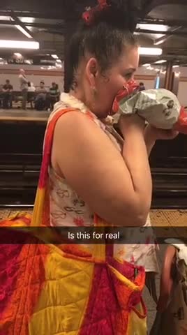 Girl lady eating chips with face inside of bag subway station