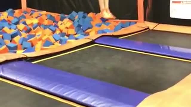 Black green shorts trampoline flip