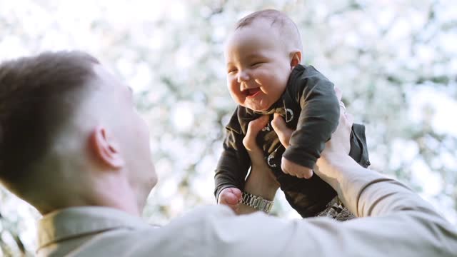 Smiling face of son with father