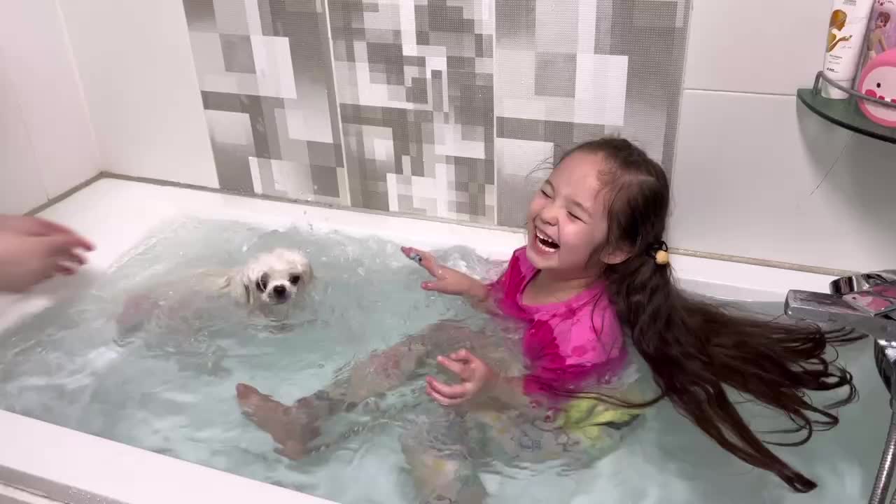 First time puppy swims in water- CHILD REACTION