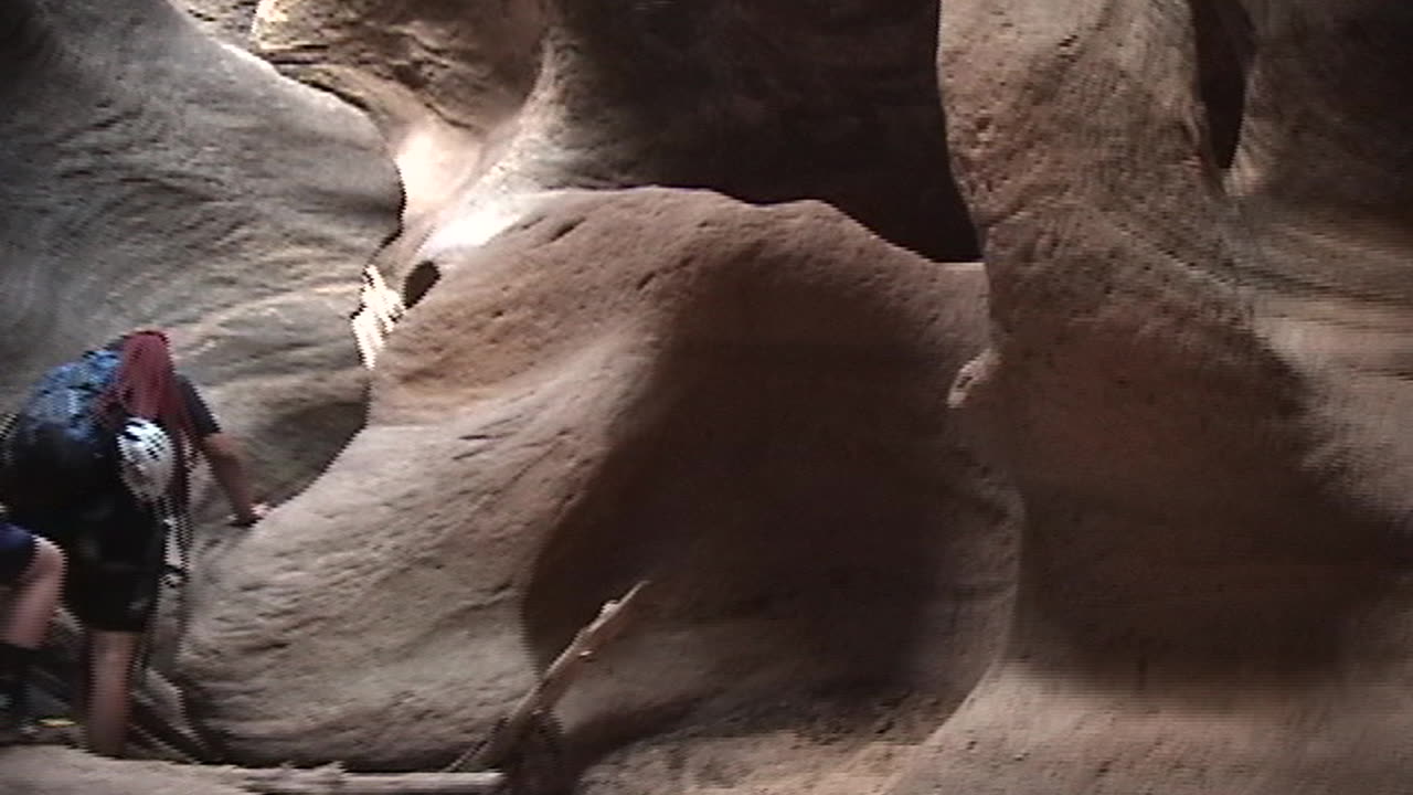 Brittany jumps into canyon water in Pine Creek Canyon