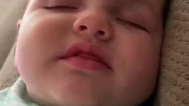 Cute Baby saying Mama while sleeping.