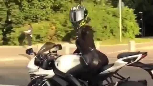 Beautiful girl driving a motorcycle