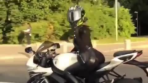 Beautiful girl driving a motorcycle