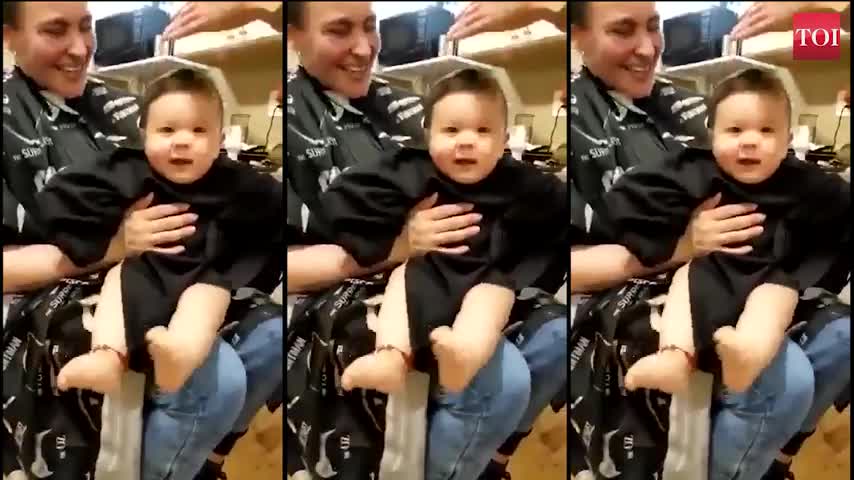 Watch as haircut tickles this toddler to laughter