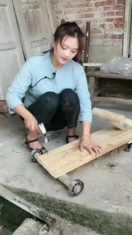 The girl made a wooden trolley