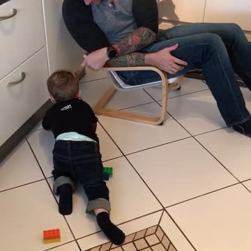 Tot Boy Hugs His Legos