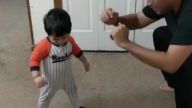 This is baby's workout time. 10 month old baby trying for squats.