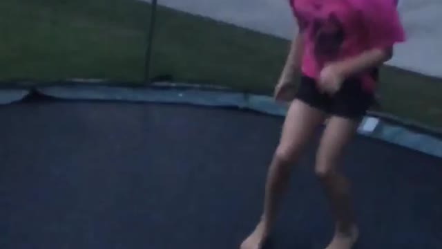 Girl in pink on blue black trampoline fail