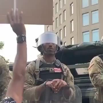 Protester elated to see soldier secretly protesting 'under his breath'