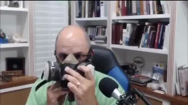 Doctor demonstrates vaping through a mask