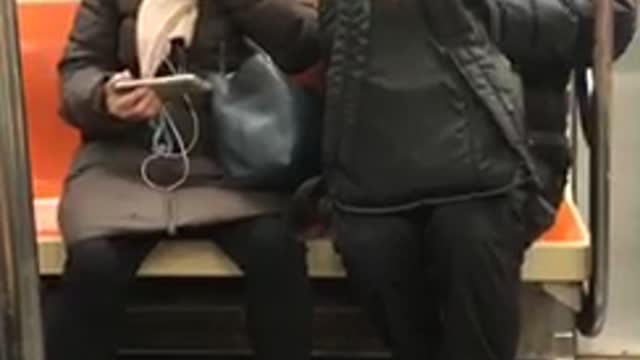 Man and woman sharing coffee on train