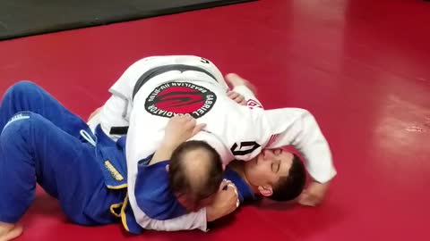 Bread cutter choke, to armbar