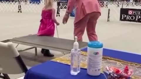 This little girl has autism. She brought her stuffed-puppy to the dog show.