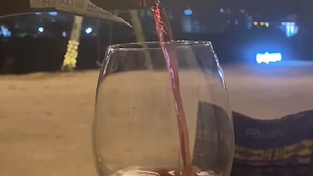 Pouring unskilled wine in a scenic spot