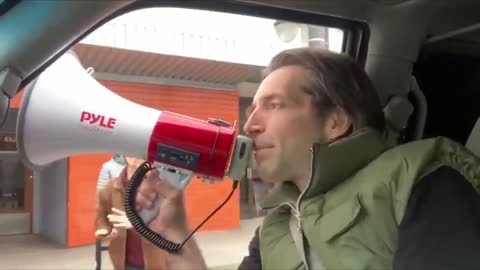 cyclist flips out, smashes car window