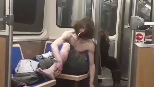 Shirtless homeless man on the train