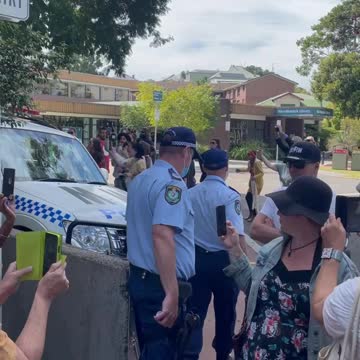 Australia: Protesters Surround Police. Police throw Protester in Van