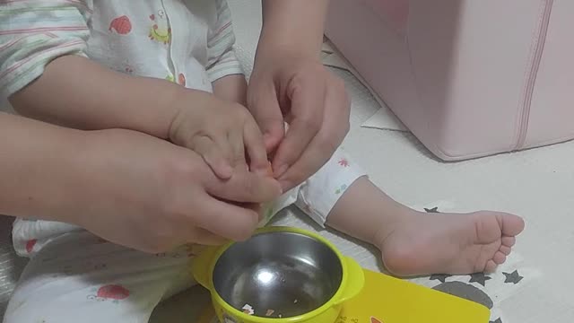 A baby who peels eggs by himself.