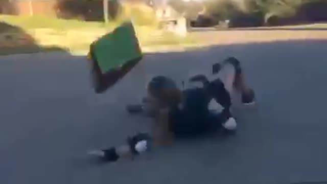 Two skateboards driveway fall butt