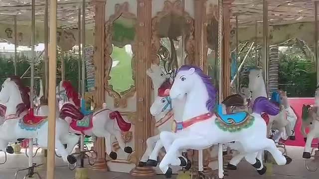 A merry go round that children like to play