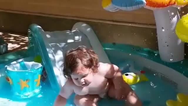 The fat baby played in the water