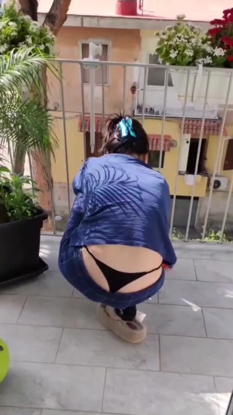 Spanish Lady Shows Her Black Thong While Cleaning