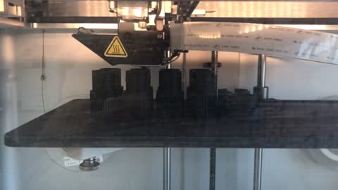 Carbon 3d printer, machine parts(sockets) are being printed.