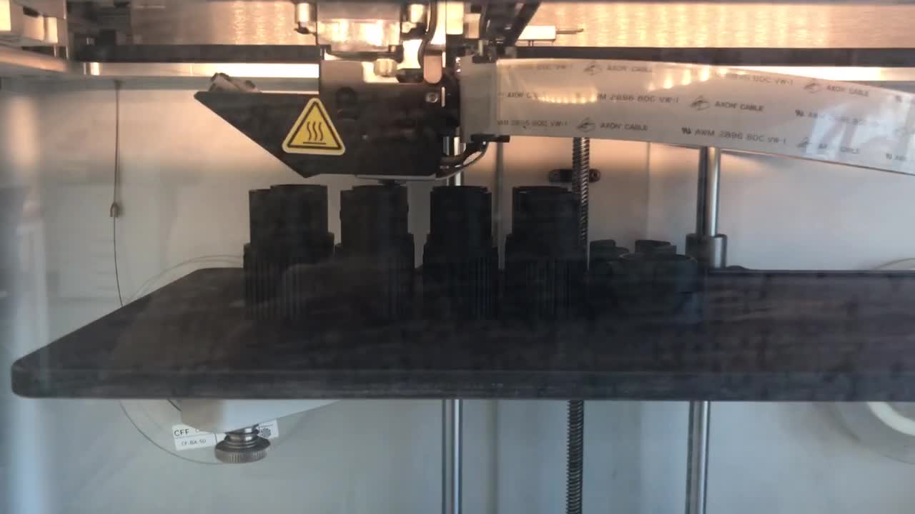 Carbon 3d printer, machine parts(sockets) are being printed.