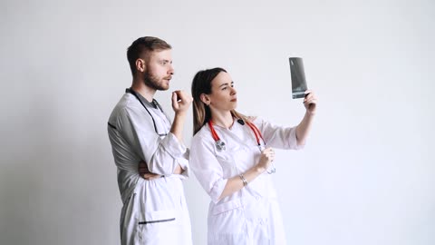 Female Doctor Holding An Xray Film