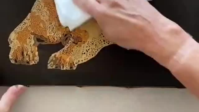Artist Makes Portrait of Puppy Using Wax And Colorful Dyes on Fabric