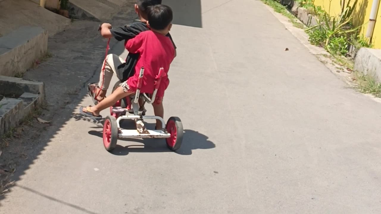 Playing bicycle with my brother