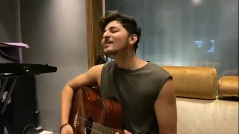 Darshan raaval singing with guitar