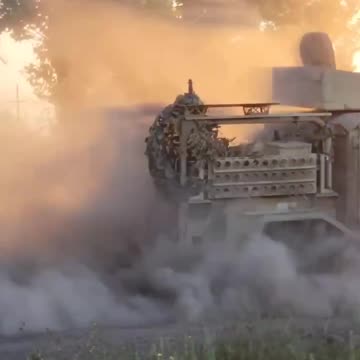 Russian tank tows a captured British made armoured vehicle