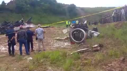 Rescuers searching through the burned remains of an aircraft that crashed Nepal, Kathmandu.