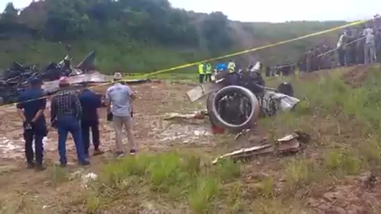 Rescuers searching through the burned remains of an aircraft that crashed Nepal, Kathmandu.