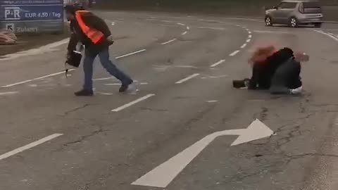 Hilarious moment Just Stop Oil protester slips in liquid she is pouring onto road.mp4