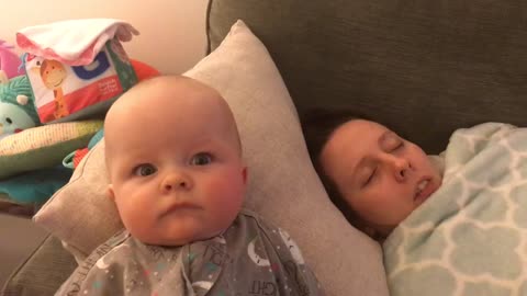 Funny baby sleeping mom