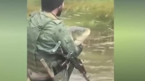 Russian war soldiers fishing with guns