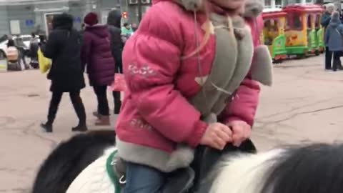 daughter riding a pony