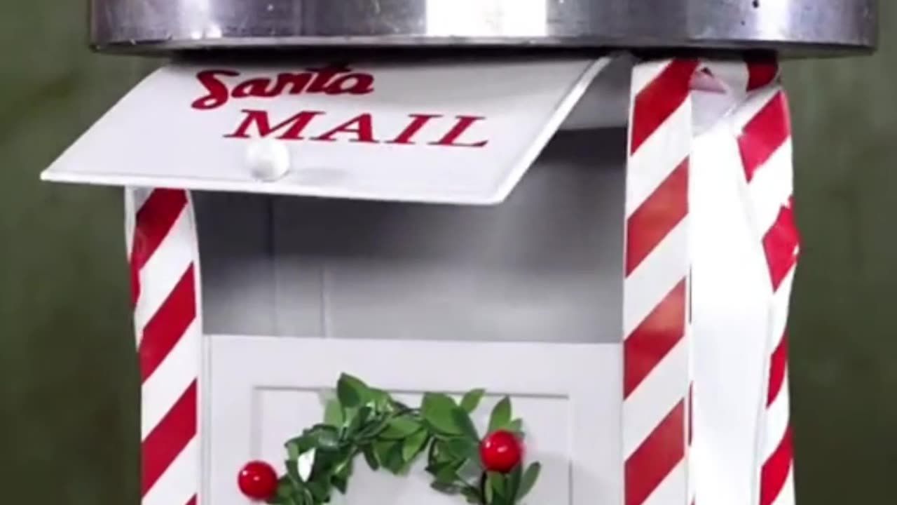Can this hydraulic press crush this Christmas spirited mail box?