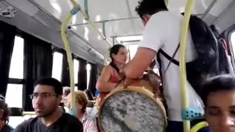 Musician on a bus, playing zamba (folk music), Montevideo