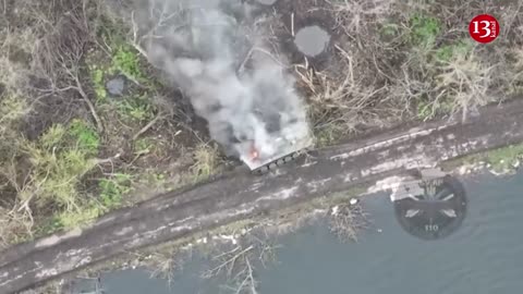 Russian armored vehicle "resting" on bank of river in Avdeyenka was targeted by Ukrainian drone