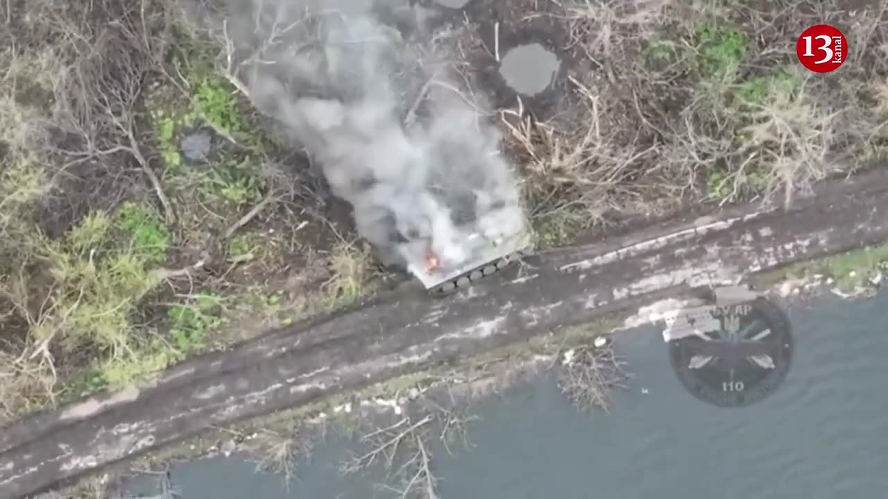 Russian armored vehicle "resting" on bank of river in Avdeyenka was targeted by Ukrainian drone