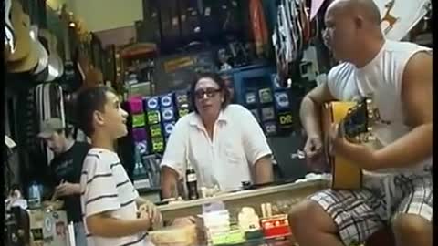 White Kid Sing The Blues In Guitar Shop Like It's Nobody's Business!
