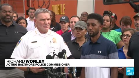 Gunman kills two and wounds dozens in Baltimore mass shooting