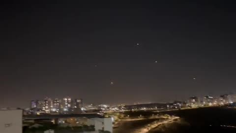 Large rocket barrage on central Israel, multiple Iron Dome interceptions.