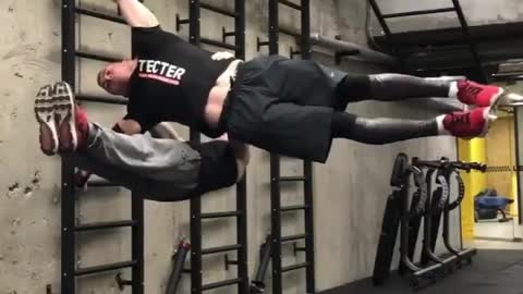 Two Men Complete an Impressive Human Flag Stunt