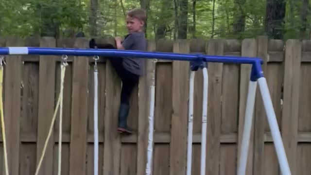 Kid Gets Stuck Trying to Climb Fence