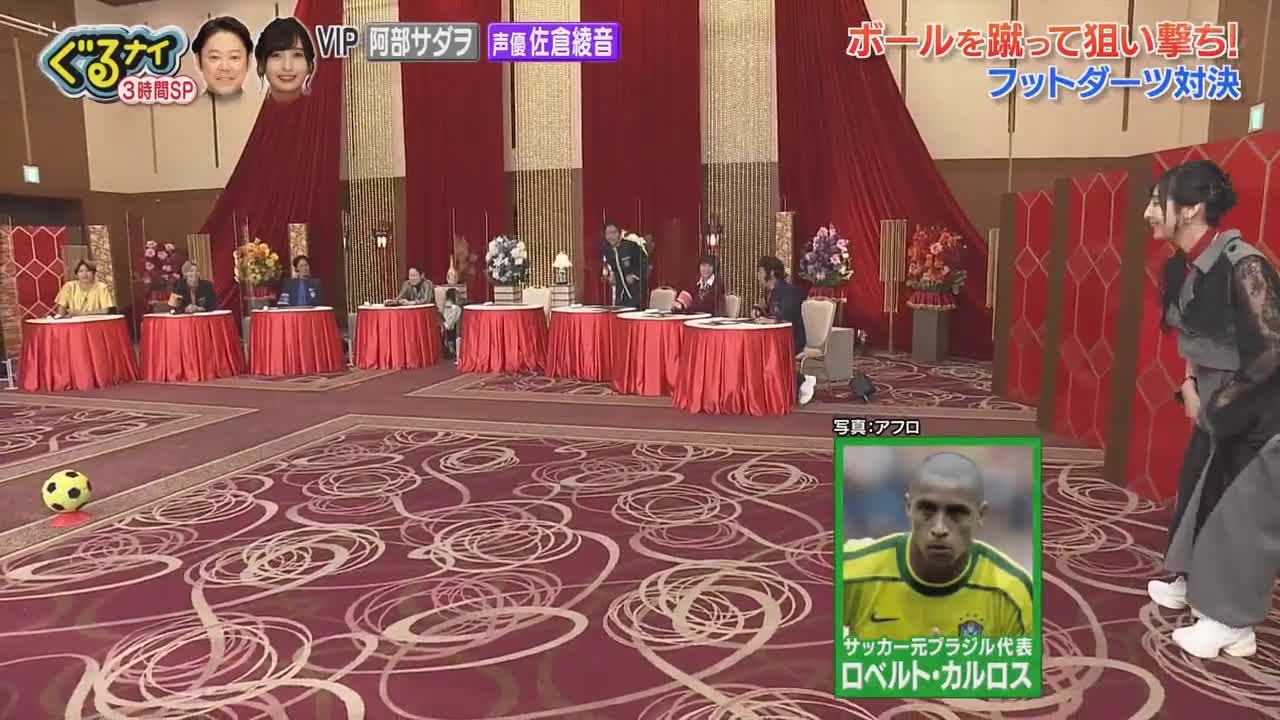 Sakura Ayane's attempted kick flies over to the staff at a Japanese variety show